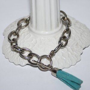 Silver toggle bracelet with aqua tassel